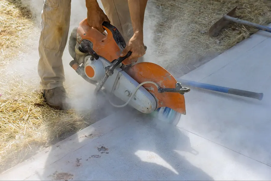 A concrete surface that is broken and in need of concrete patching for repair